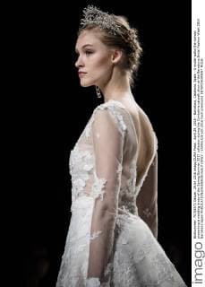 April 29, 2016 - Barcelona, Catalonia, Spain - A model walks the runway presenting a wedding dress of the Spring Summer 2017 collection during the Cymbeline catwalk show at the Barcelona Bridal Fashion Week 2016 Barcelona Spain - ZUMAo105
