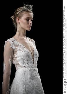 April 29, 2016 - Barcelona, Catalonia, Spain - A model walks the runway presenting a wedding dress of the Spring Summer 2017 collection during the Cymbeline catwalk show at the Barcelona Bridal Fashion Week 2016 Barcelona Spain - ZUMAo105