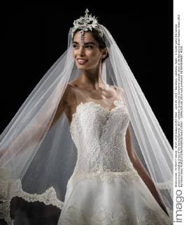 April 29, 2016 - Barcelona, Catalonia, Spain - A model walks the runway presenting a wedding dress of the Spring Summer 2017 collection during the Cymbeline catwalk show at the Barcelona Bridal Fashion Week 2016 Barcelona Spain - ZUMAo105