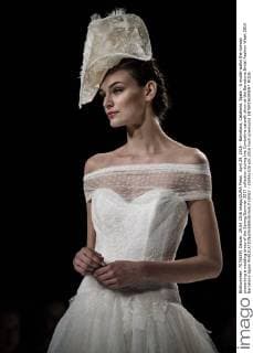 April 29, 2016 - Barcelona, Catalonia, Spain - A model walks the runway presenting a wedding dress of the Spring Summer 2017 collection during the Cymbeline catwalk show at the Barcelona Bridal Fashion Week 2016 Barcelona Spain - ZUMAo105