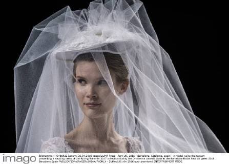 April 29, 2016 - Barcelona, Catalonia, Spain - A model walks the runway presenting a wedding dress of the Spring Summer 2017 collection during the Cymbeline catwalk show at the Barcelona Bridal Fashion Week 2016 Barcelona Spain - ZUMAo105