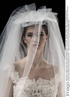 April 29, 2016 - Barcelona, Catalonia, Spain - A model walks the runway presenting a wedding dress of the Spring Summer 2017 collection during the Cymbeline catwalk show at the Barcelona Bridal Fashion Week 2016 Barcelona Spain - ZUMAo105
