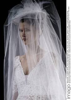 April 29, 2016 - Barcelona, Catalonia, Spain - A model walks the runway presenting a wedding dress of the Spring Summer 2017 collection during the Cymbeline catwalk show at the Barcelona Bridal Fashion Week 2016 Barcelona Spain - ZUMAo105