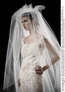 April 29, 2016 - Barcelona, Catalonia, Spain - A model walks the runway presenting a wedding dress of the Spring Summer 2017 collection during the Cymbeline catwalk show at the Barcelona Bridal Fashion Week 2016 Barcelona Spain - ZUMAo105