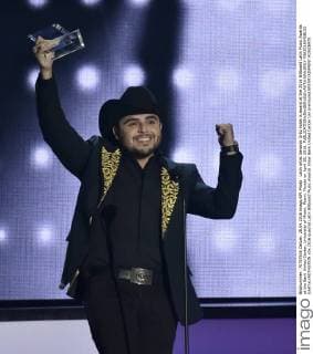 Latin artist Gerardo Ortiz holds is award at the 2016 Billboard Latin Music Awards at the Bank United Center, University of Miami, Miami, Florida on April 28, 2016.  MIA20160428132 GARYxIxROTHSTEIN