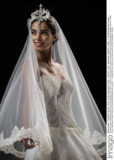 April 29, 2016 - Barcelona, Catalonia, Spain - A model walks the runway presenting a wedding dress of the Spring Summer 2017 collection during the Cymbeline catwalk show at the Barcelona Bridal Fashion Week 2016. Barcelona Spain - ZUMAo105