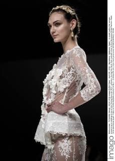 April 29, 2016 - Barcelona, Catalonia, Spain - A model walks the runway presenting a wedding dress of the Spring Summer 2017 collection during the Carla Ruiz catwalk show at the Barcelona Bridal Fashion Week 2016 Barcelona Spain - ZUMAo105