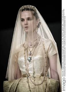 April 29, 2016 - Barcelona, Catalonia, Spain - A model walks the runway presenting a wedding dress of the Spring Summer 2017 collection during the Carla Ruiz catwalk show at the Barcelona Bridal Fashion Week 2016 Barcelona Spain - ZUMAo105