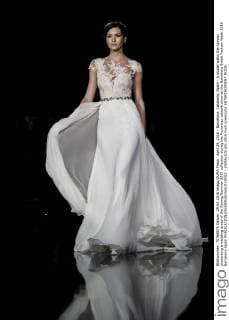 April 29, 2016 - Barcelona, Catalonia, Spain - A model walks the runway presenting a wedding dress of the Spring Summer 2017 collection during the Pronovias catwalk show at the Barcelona Bridal Fashion Week 2016 Barcelona Spain - ZUMAo105