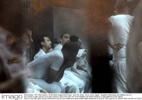 April 30, 2016 - Cairo, Cairo, Egypt - Egyptian defendants wait behind bars for the verdict in their retrial over a 2012 stadium riot in the canal city of Port Said at the police academy on the outskirts of the capital Cairo on April 30, 2016. Seven defendants wait for the verdict as a court upheld death sentences on June 9, 2015 against 11 football fans over the riot which broke out when fans of home team Al-Masry and Cairo s Al-Ahly clashed after a premier league match between the two clubs, leaving 74 people dead on May 30, 2015 Cairo Egypt - ZUMAap3_