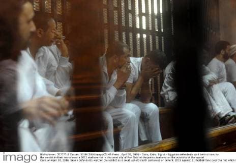 April 30, 2016 - Cairo, Cairo, Egypt - Egyptian defendants wait behind bars for the verdict in their retrial over a 2012 stadium riot in the canal city of Port Said at the police academy on the outskirts of the capital Cairo on April 30, 2016. Seven defendants wait for the verdict as a court upheld death sentences on June 9, 2015 against 11 football fans over the riot which broke out when fans of home team Al-Masry and Cairo s Al-Ahly clashed after a premier league match between the two clubs, leaving 74 people dead on May 30, 2015 Cairo Egypt - ZUMAap3_