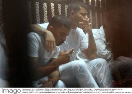 April 30, 2016 - Cairo, Cairo, Egypt - Egyptian defendants wait behind bars for the verdict in their retrial over a 2012 stadium riot in the canal city of Port Said at the police academy on the outskirts of the capital Cairo on April 30, 2016. Seven defendants wait for the verdict as a court upheld death sentences on June 9, 2015 against 11 football fans over the riot which broke out when fans of home team Al-Masry and Cairo s Al-Ahly clashed after a premier league match between the two clubs, leaving 74 people dead on May 30, 2015 Cairo Egypt - ZUMAap3_