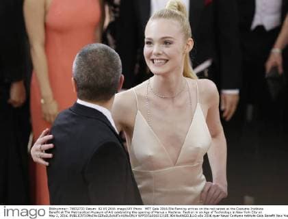 MET Gala 2016 Elle Fanning arrives on the red carpet at the Costume Institute Benefit at The Metropolitan Museum of Art celebrating the opening of Manus x Machina: Fashion in an Age of Technology in New York City on May 2, 2016.  NYP2016050212185 JOHNxANGELILLO