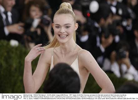 MET Gala 2016 Elle Fanning arrives on the red carpet at the Costume Institute Benefit at The Metropolitan Museum of Art celebrating the opening of Manus x Machina: Fashion in an Age of Technology in New York City on May 2, 2016.  NYP2016050212282 JOHNxANGELILLO
