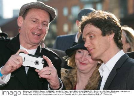 May 4, 2016 - West Midlands, UK - Birmingham, UK. Peaky Blinders cast members and guests attending a special premiere at the Mailbox in Birmingham, for series three. P ictured, Cillian Murphy, right, poses with Peaky Blinders fans. UK  - ZUMAl94_