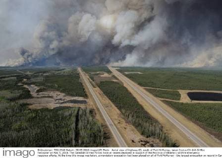 Aerial view of highway 63, south of Fort McMurray, taken from a CH-146 Griffon helicopter on May 5, 2016. The Canadian Armed Forces have air assets deployed in support of the Province of Alberta s wildfire emergency response efforts. At the time this image was taken, a mandatory evacuation had been placed on all of Fort McMurray - the largest evacuation on record in Canada. The fire had burned through nearly 77 square kilometers, razing neighborhoods across the city.  WAX2016050626 MCplxVanPutten