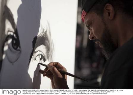 May 6, 2016 - Los Angeles, CA, USA - Artist Enkone paints a portrait of Prince during the Prince Tribute concert held at the Los Angeles City Hall located in Los Angeles, California, on Friday, March 6, 2016. Los Angeles USA - ZUMAh129