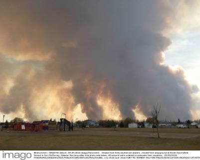 Smoke from fires several km distant, viewed from playground at Ecole Dickinsfield School in Fort McMurray, Alberta. Not long after this photo was taken, all schools were ordered to evacuate their students. 04 05 2016 PANORAMIC GREGHALINDA 