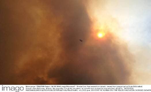 Smoke from fires several km distant, viewed from playground at Ecole Dickinsfield School in Fort McMurray, Alberta. Not long after this photo was taken, all schools were ordered to evacuate their students. 04 05 2016 PANORAMIC GREGHALINDA 