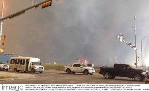 Smoke from fires several km distant, viewed from playground at Ecole Dickinsfield School in Fort McMurray, Alberta. Not long after this photo was taken, all schools were ordered to evacuate their students. 04 05 2016 PANORAMIC GREGHALINDA 