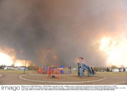 Wildfire smoke visible from the playground at Ecole Dickinsfield School in Fort McMurray, Alberta, hours before the city was ordered evacuated. 04 05 2016 PANORAMIC GREGHALINDA 