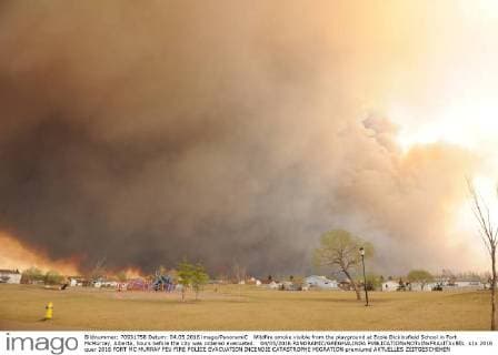 Wildfire smoke visible from the playground at Ecole Dickinsfield School in Fort McMurray, Alberta, hours before the city was ordered evacuated. 04 05 2016 PANORAMIC GREGHALINDA 