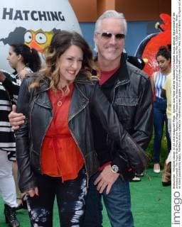 Actress Jolie Fisher and her husband Christopher Duddy attends the premiere of the animated comedy The Angry Birds Movie at the Regency Village Theatre in the Westwood section of Los Angeles on May 7, 2016. Storyline: When an island populated by happy, flightless birds is visited by mysterious green piggies, it s up to three unlikely outcasts - Red, Chuck and Bomb - to figure out what the pigs are up to.  LAP2016050723 JIMxRUYMEN