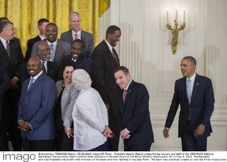 President Barack Obama greets former players and staff of the 1983 NCAA National Basketball Championship North Carolina State Wolfpack in the East Room of the White House in Washington, DC on May 9, 2016. The President and Vice President met briefly with members of the team and their families in the East Room. The team was previously unable to visit the White House to be recognized for their championship. Pool  WAX20160509104 SHAWNxTHEW