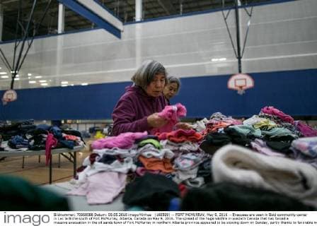 (160509) -- FORT MCMURRAY, May 9, 2016 -- Evacuees are seen in Bold community center in Lac la Biche south of Fort McMurray, Alberta, Canada on May 9, 2016. The spread of the huge wildfire in western Canada that has forced a massive evacuation in the oil sands town of Fort McMurray in northern Alberta province appeared to be slowing down on Sunday, partly thanks to favorable weather. ) CANADA-FORT MCMURRAY-WILDFIRE-AFTERMATH AmruxSalahuddien 