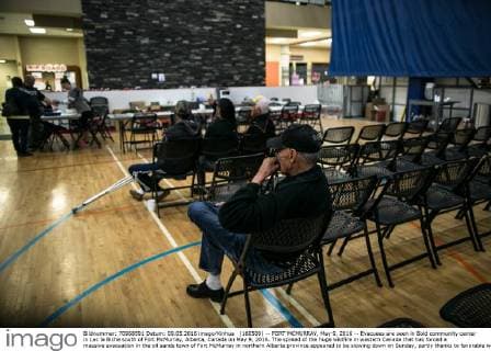 (160509) -- FORT MCMURRAY, May 9, 2016 -- Evacuees are seen in Bold community center in Lac la Biche south of Fort McMurray, Alberta, Canada on May 9, 2016. The spread of the huge wildfire in western Canada that has forced a massive evacuation in the oil sands town of Fort McMurray in northern Alberta province appeared to be slowing down on Sunday, partly thanks to favorable weather. ) CANADA-FORT MCMURRAY-WILDFIRE-AFTERMATH AmruxSalahuddien 