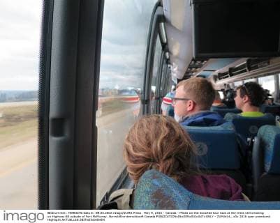 May 9, 2016 - Canada - Media on the escorted tour look at the trees still smoking on Highway 63 outside of Fort McMurray. Na-wildfire-demolition9 Canada  - ZUMAt14_