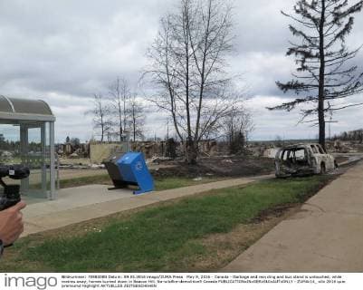 May 9, 2016 - Canada - Garbage and recycling and bus stand is untouched, while metres away, homes burned down in Beacon Hill. Na-wildfire-demolition9 Canada  - ZUMAt14_