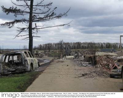 May 9, 2016 - Canada - The Beacon Hill neighbourhood of Fort McMurray was hit very hard by the wildfires, with 80 per cent of the neighbourhood gone, according to the fire chief. Na-wildfire-demolition9 Canada  - ZUMAt14_