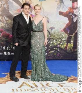 American actor Johnny Depp and Australian actress Mia Wasikowska attend the premiere of Alice Through The Looking Glass at Odeon, Leicester Square in London on May 10, 2016.  LON20160510117 RUNExHELLESTAD