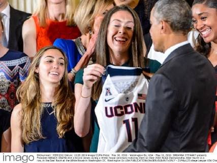 May 10, 2016 - Washington Dc, USA - May 10, 2016: BREANNA STEWART presents President BARACK OBAMA with a UConn jersey during a White House ceremony honoring them on their 2016 NCAA Championship, their fourth in a row, in the East Room at the White House in Washington DC. Washington Dc USA - ZUMAs125