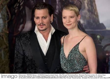 Alice Through The Looking Glass - European Premiere London. UK. Johnny Depp and Mia Wasikowska at The European Premiere of Alice Through The Looking Glass at Leicester Square Garden, London, England, UK on Tuesday 10 May 2016 LMK370-22697-071010 