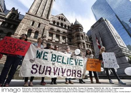 May 11, 2016 - Toronto, NY, Canada - TORONTO, ON - MAY 11 - Protestors stand outside after Jian Ghomeshi and his lawyer Marie Henein arrived at Old City Hall court. A charge of sexual assault against Ghomeshi was withdrawn this morning after the former CBC broadcaster apologized to a former colleague in court and signed a peace bond.May 11, 2016. Toronto Canada  - ZUMAt14_