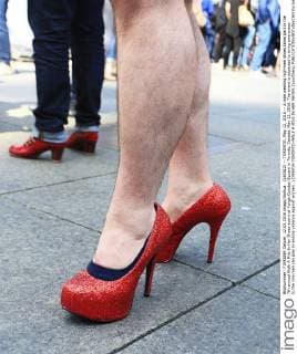 (160512) -- TORONTO, May 12, 2016 -- A man wearing high-heel shoes takes part in the 7th annual Walk A Mile In Her Shoes event at Yonge-Dundas Square in Toronto, Canada, May 12, 2016. The event is expected to bring awareness to the role men can play in ending violence against women. ) CANADA-TORONTO-WALK A MILE IN HER SHOES ZouxZheng 