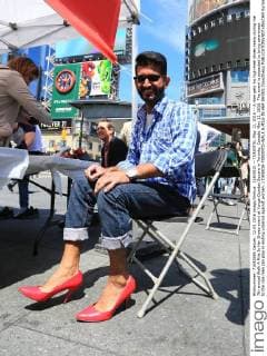 (160512) -- TORONTO, May 12, 2016 -- A man gets his high-heel shoes ready during the 7th annual Walk A Mile In Her Shoes event at Yonge-Dundas Square in Toronto, Canada, May 12, 2016. The event is expected to bring awareness to the role men can play in ending violence against women. ) CANADA-TORONTO-WALK A MILE IN HER SHOES ZouxZheng 