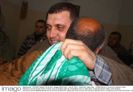 Feb 05, 2011 - Gaza City, Gaza Strip - AYMAN NOFAL a prominent member of the Palestinian militant group Hamas military wing Al-Qassam upon his arrival back home in Gaza Strip s Nusairat refugee camp. Nofal escaped last week from an Egyptian prison during the anti-government unrest and made his way into the Gaza Strip through a smuggling tunnel under the border. He was greeted by a celebratory crowd, some of whom fired shots in the air. - ZUMAap3_