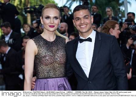 (160516) -- CANNES, May 16, 2016 -- Soccer player Hatem Ben Arfa (R) and a guest pose on the red carpet as they arrive for the screening of film Loving in competition at the 69th Cannes Film Festival in Cannes, France, May 16, 2016. ) FRANCE-CANNES-FILM FESTIVAL-LOVING-RED CARPET JinxYu 
