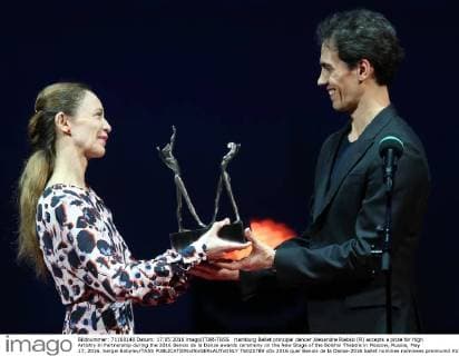 Hamburg Ballet principal dancer Alexandre Riabko (R) accepts a prize for High Artistry in Partnership during the 2016 Benois de la Danse awards ceremony on the New Stage of the Bolshoi Theatre in Moscow, Russia, May 17, 2016. Sergei Bobylev TASS  TS0237B9