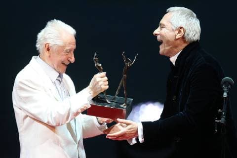 Russian choreographer Yury Grigorovich (L) and American ballet dancer, choreographer John Neumeier, awarded with the Life in Art prize, during the 2016 Benois de la Danse awards ceremony on the New Stage of the Bolshoi Theatre in Moscow, Russia, May 17, 2016. Sergei Bobylev TASS  TS0237C7