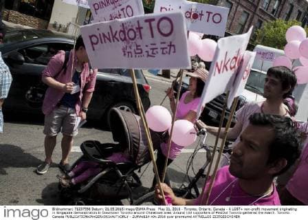 May 21, 2016 - Toronto, Ontario, Canada - A LGBT+ non-profit movement originating in Singapore demonstration in Downtown Toronto around Chinatown area. Around 100 supporters of PinkDot Toronto gathered the march. Toronto Canada - ZUMAd114