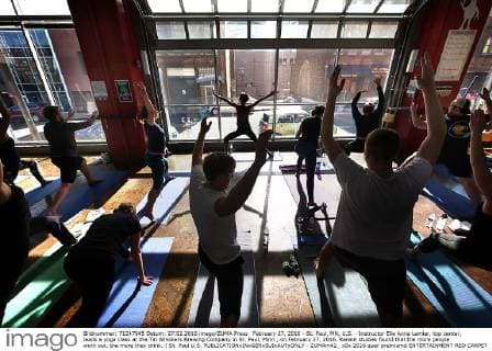 February 27, 2016 - St. Paul, MN, U.S. - Instructor Elle Anna Lemler, top center, leads a yoga class at the Tin Whiskers Brewing Company in St. Paul, Minn., on February 27, 2016. Recent studies found that the more people work out, the more they drink. ( St. Paul U.S. - ZUMAm42_