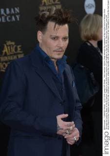 Cast member Johnny Depp attends the premiere of the motion picture fantasy Alice Through the Looking Glass at the El Capitan Theatre in the Hollywood section of Los Angeles on May 23, 2016. Storyline: Nineteen-year-old Alice returns to the magical world from her childhood adventure, where she reunites with her old friends and learns of her true destiny: to end the Red Queen s reign of terror.  LAP2016052302 JIMxRUYMEN