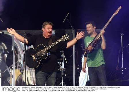May 28, 2016 - Daytona, Florida, United States - Joe Diffie (L) performs during the Great American Music Fest at Daytona - Country 500 - Day 2 at Daytona International Speedway. Daytona United States - ZUMAw109