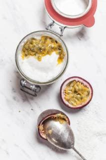 Bowl of vegan coconut yogurt with passion fruit pulp  SBDF002793