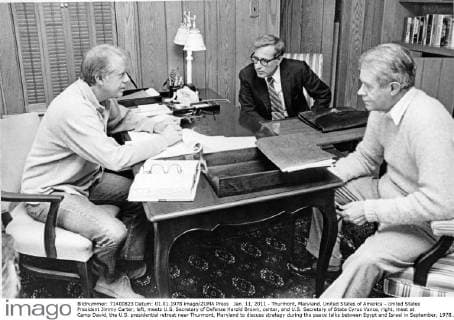 Jan. 11, 2011 - Thurmont, Maryland, United States of America - United States President Jimmy Carter, left, meets U.S. Secretary of Defense Harold Brown, center, and U.S. Secretary of State Cyrus Vance, right, meet at Camp David, the U.S. presidential retreat near Thurmont, Maryland to discuss strategy during the peace talks between Egypt and Israel in September, 1978.. - ZUMAs152