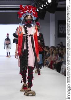London, UK. 5 June 2016. A model walks the runway showcasing the fashion collection by Wenyue Zhang from Northumbria University during Graduate Fashion Week 2016. GFW takes place at the Old Truman Brewery from 5 to 8 June 2016. Northumbria University, Graduate Fashion Week 2016 
